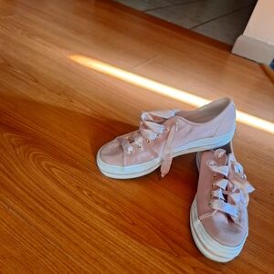 Pink satin Kate spade edition keds platform tennis shoes.